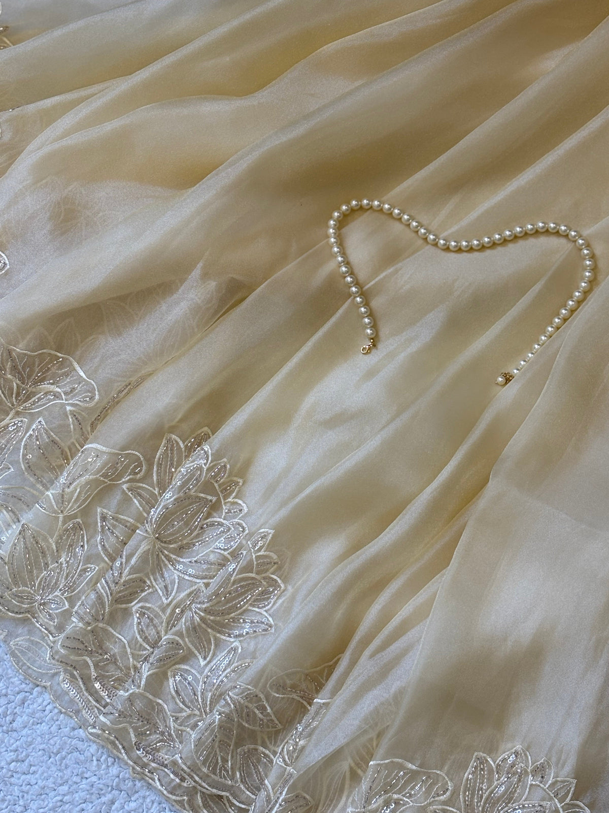 Chandni | Soft Tissue Organza Saree in Butter Cream with Hand-Embroidered Lotus Border